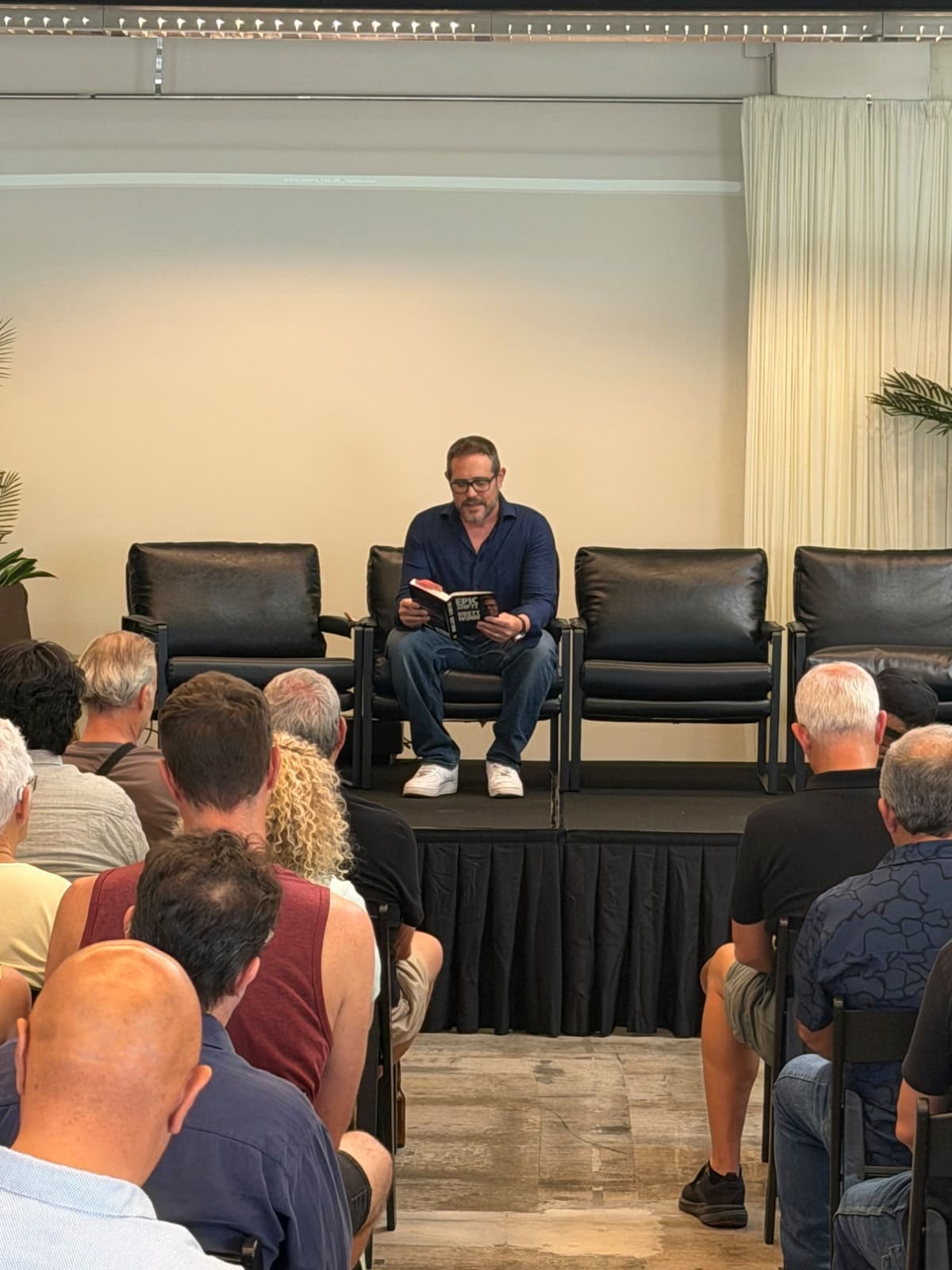 Brett reading from EPIC SHIFTS on stage